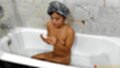 Seated in bath naked