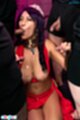 On her knees wearing red dress sucking cock giving handjob