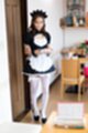 Wearing maid outfit in white stockings wearing high heels