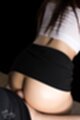 Leaning forward giving assjob wearing short skirt