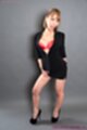 Wearing short skirt in black high heels