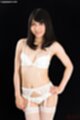 Saionji reo in lingerie bra and panties wearing stockings hand on hip