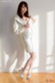 Wearing white jacket in skirt high heels