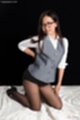 On her knees in short skirt wearing pantyhose