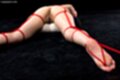 Mizuki tied up naked on her front legs spread